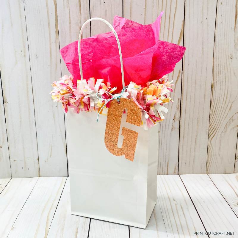 gift bag with garland and letter gift tag