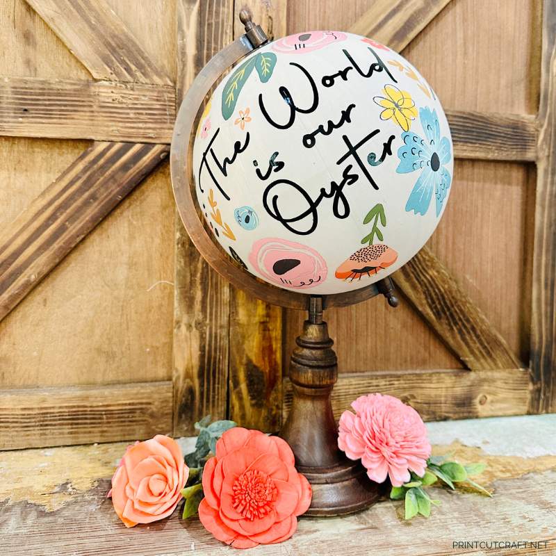 The world is our oyster converted from handwriting on a floral globe
