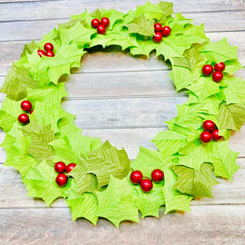 Crepe paper holly wreath